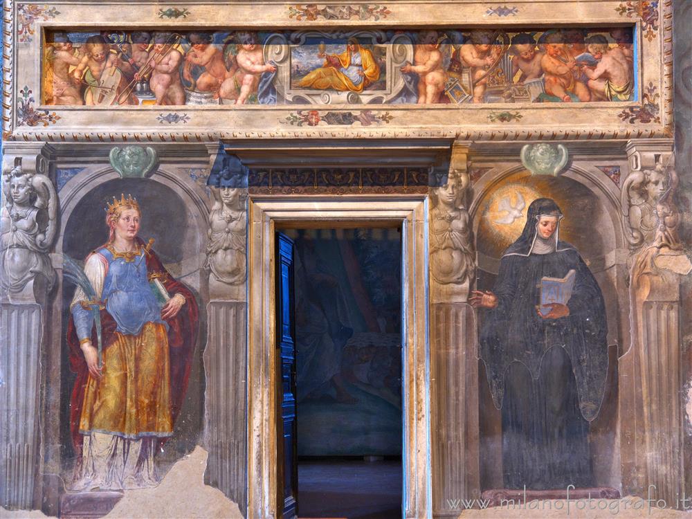 Milan (Italy) - Base of the left choir loft in the Basilica of San Simpliciano